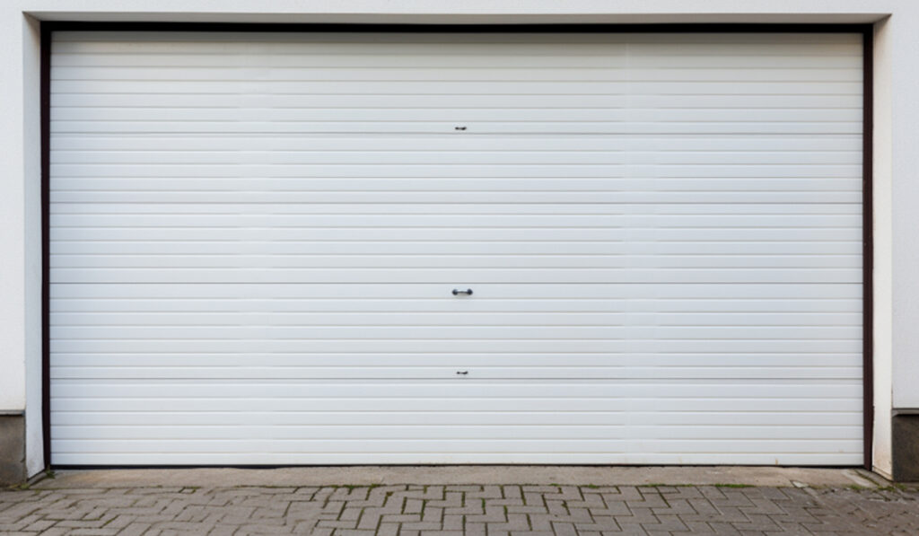 White overhead garage door. Install hi-speed doors for your business.