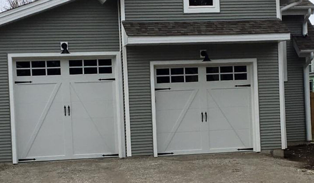 Residential home with clopay coachmen style garage doors.