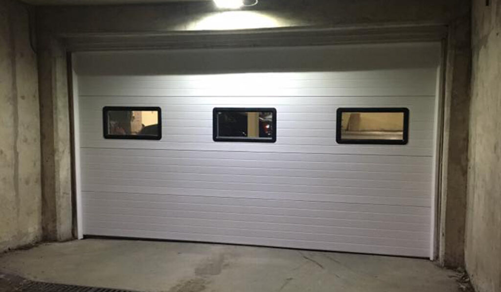 overhead garage door in an underground parking lot