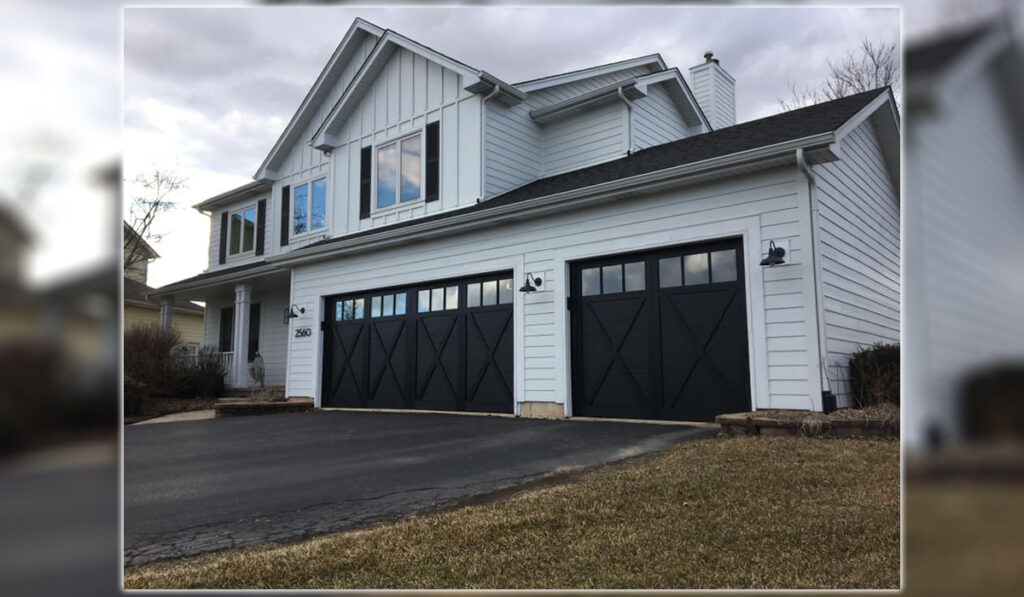 A white two-story house with HAAS CARBON BLACK 600 SERIES garage door.
