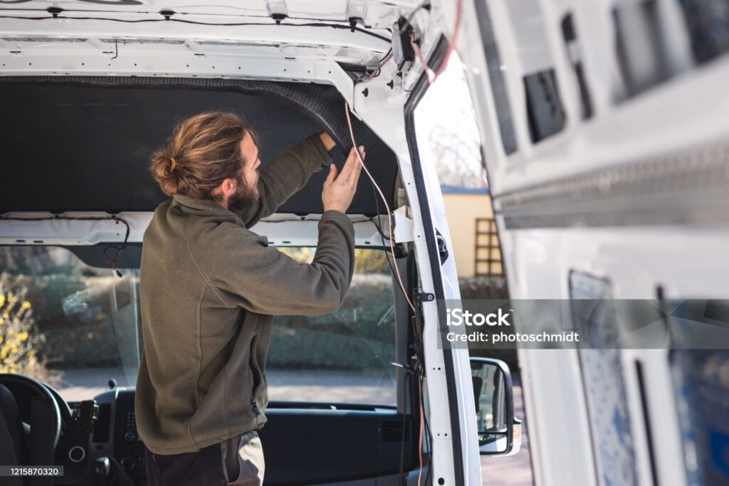 Man installing cable on a truck