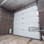 large car garage with sectional doors