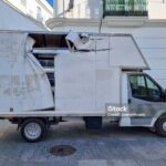 Damaged truck parked on the street