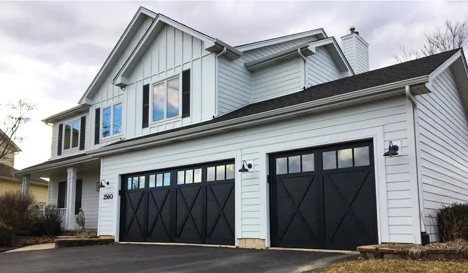 Modern home with energy-efficient garage door insulation, enhancing thermal control and appearance for year-round comfort.