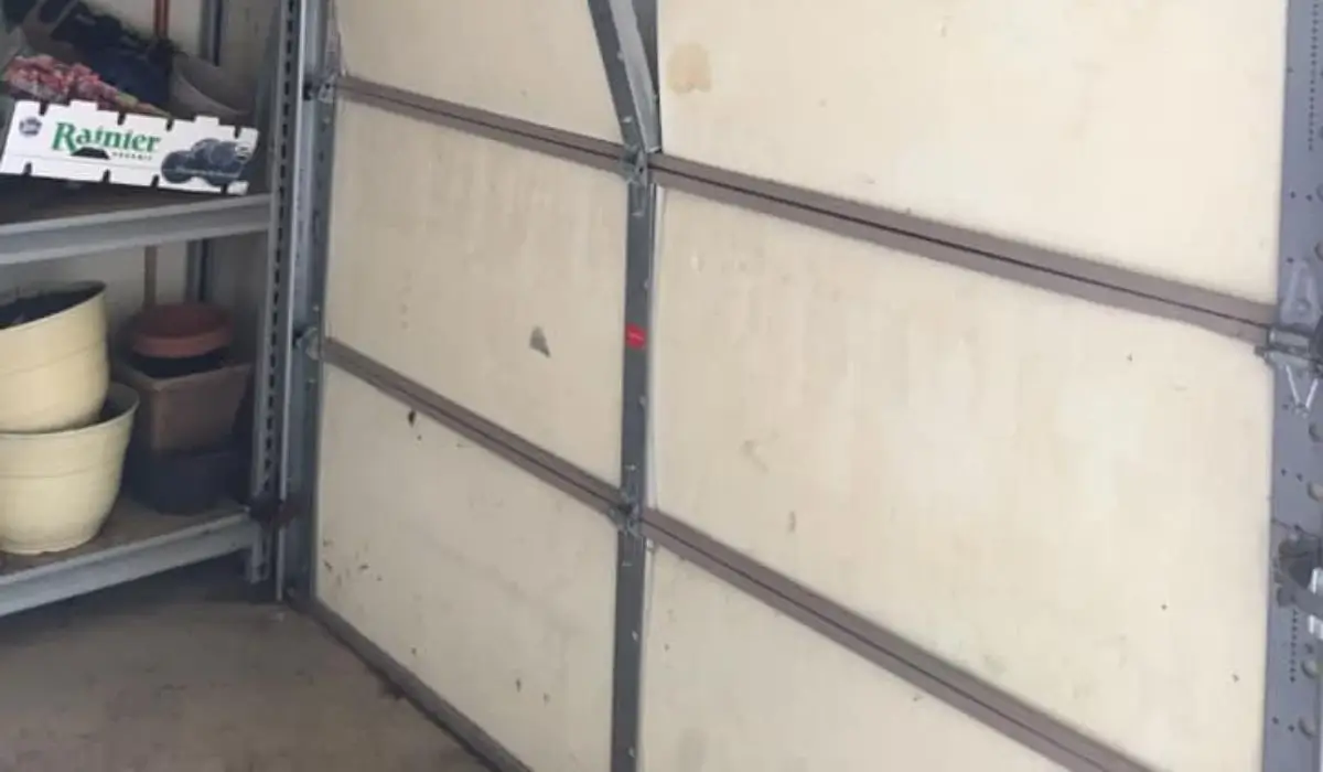 Reinforced garage door with steel brackets to improve storm protection and meet modern garage door standards.