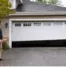 Homeowner observing unusual garage door movement before winter and considering garage door repair as problems develop.
